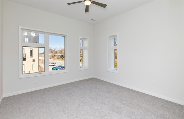 carpeted empty room with ceiling fan