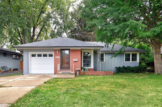 ranch-style home with a front yard and a garage