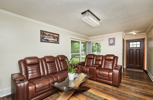 living room with crown molding, a textured ceiling, an inviting chandelier, and dark hardwood / wood-style flooring