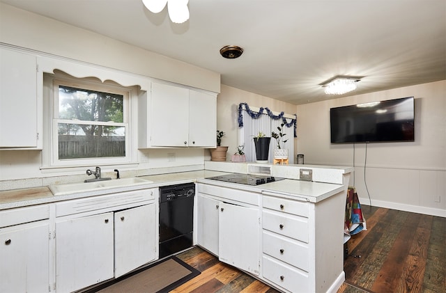 kitchen with black appliances, sink, kitchen peninsula, and white cabinets