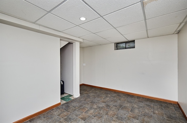 basement featuring a drop ceiling