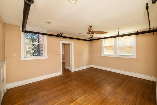 3940 University Ave Unit 1, Des Moines, IA 50311 - spare room with ceiling fan and dark wood finished floors