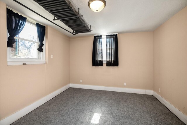 3940 University Ave Unit 1, Des Moines, IA 50311 - unfurnished room featuring carpet and baseboards