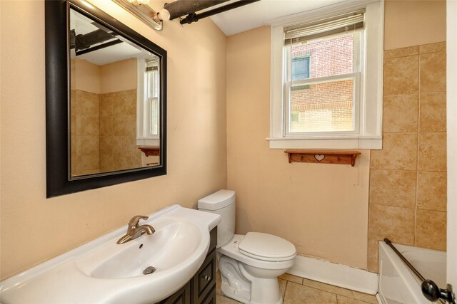 3940 University Ave Unit 1, Des Moines, IA 50311 - full bathroom with vanity and tile patterned floors