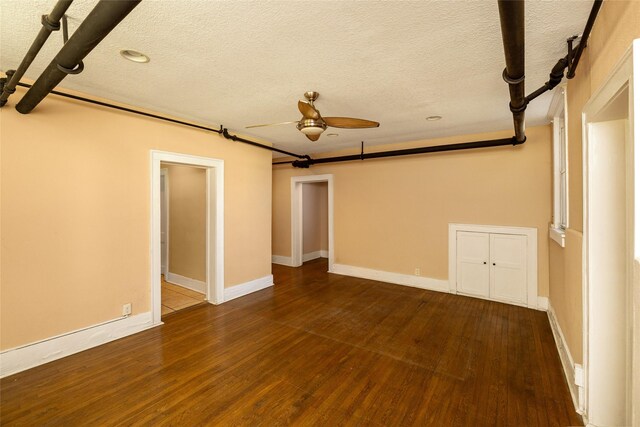 3940 University Ave Unit 1, Des Moines, IA 50311 - unfurnished room with a ceiling fan, wood finished floors, and a textured ceiling