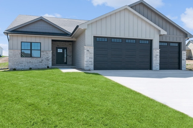 view of front of home featuring a garage and a front lawn