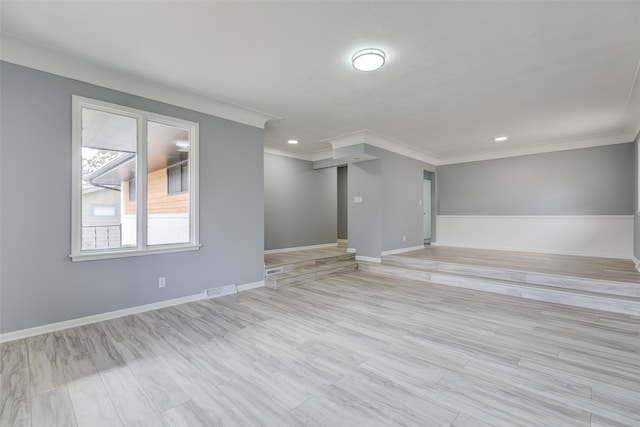 unfurnished room featuring crown molding and light hardwood / wood-style flooring