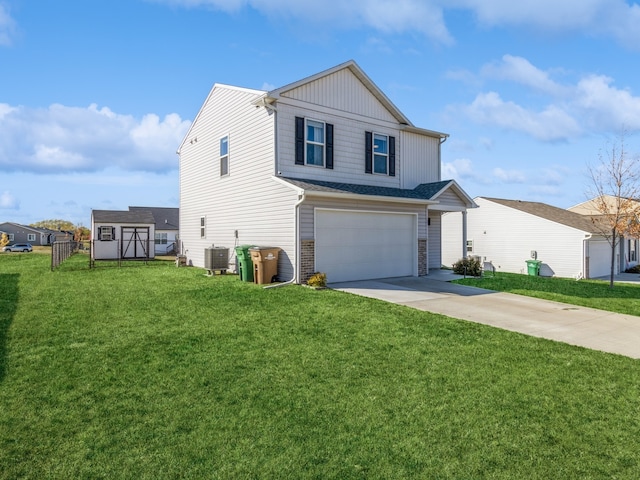 view of front of property featuring a garage, a front lawn, and central AC unit