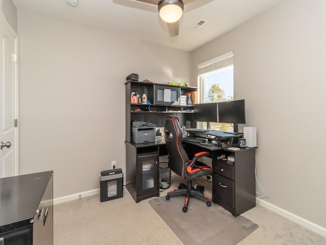 office with carpet floors, baseboards, visible vents, and a ceiling fan