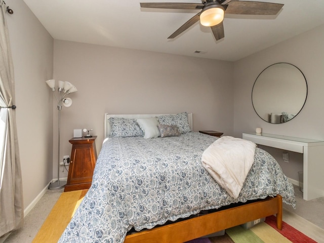 bedroom featuring carpet floors, visible vents, baseboards, and a ceiling fan