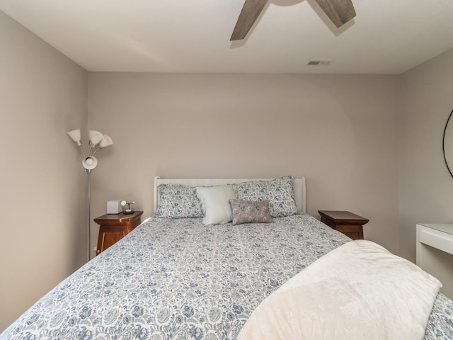 bedroom with visible vents and a ceiling fan