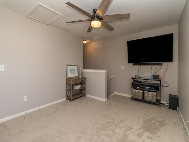 living room with carpet flooring, attic access, and baseboards