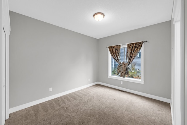 view of carpeted spare room