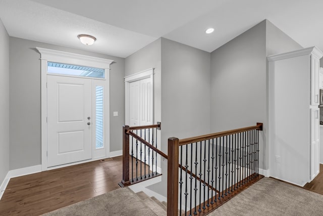 foyer entrance featuring dark hardwood / wood-style floors