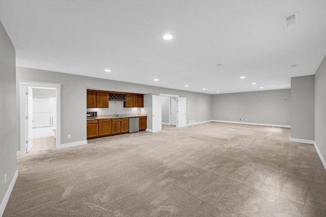 unfurnished living room featuring light colored carpet