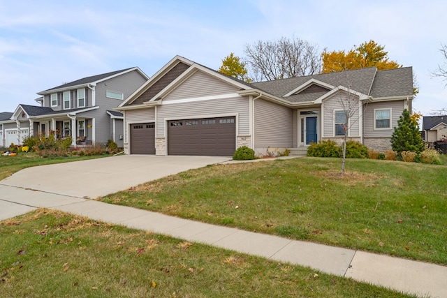 view of front of house featuring a front yard and a garage