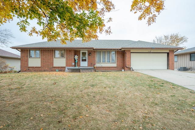 single story home with a front yard and a garage