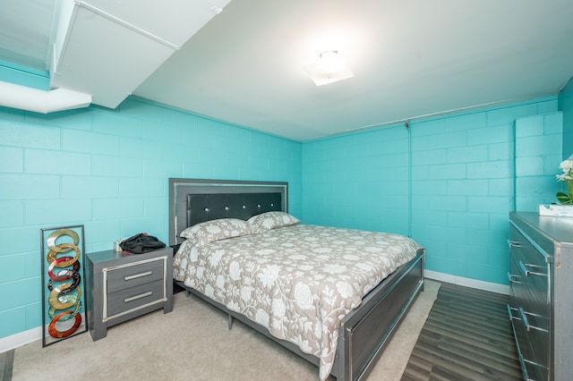 bedroom featuring light colored carpet