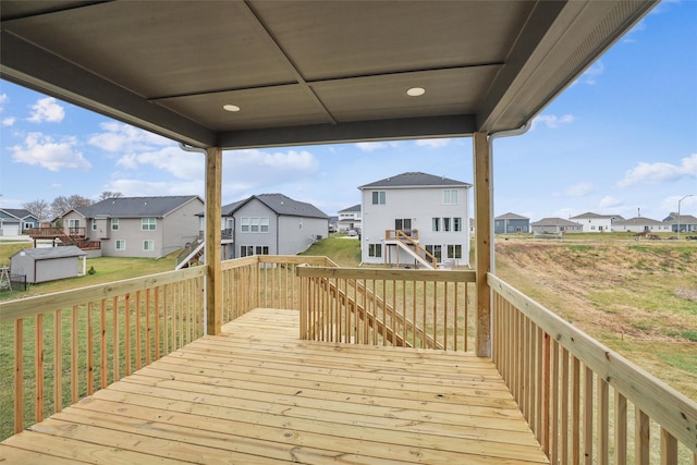 wooden deck featuring a residential view