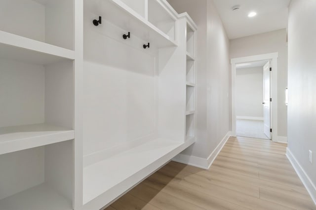 mudroom with hardwood / wood-style flooring