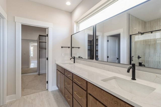 bathroom with vanity and an enclosed shower