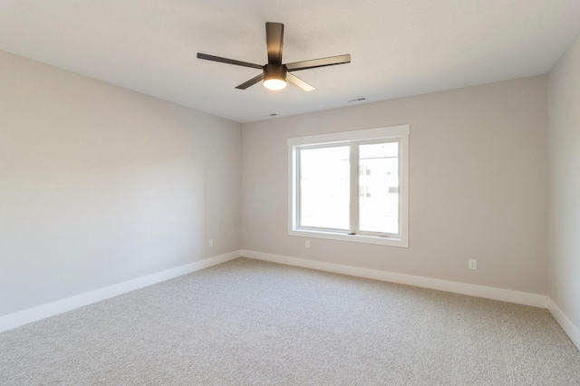 empty room with carpet floors and ceiling fan