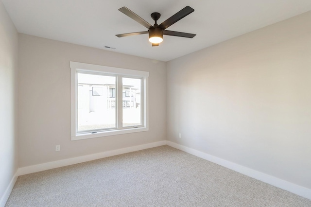 unfurnished room featuring ceiling fan and carpet flooring