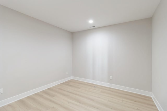 spare room with light hardwood / wood-style floors