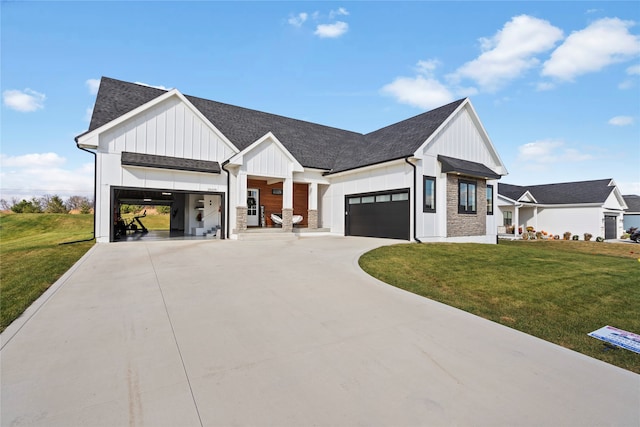 modern farmhouse featuring a front yard and a garage