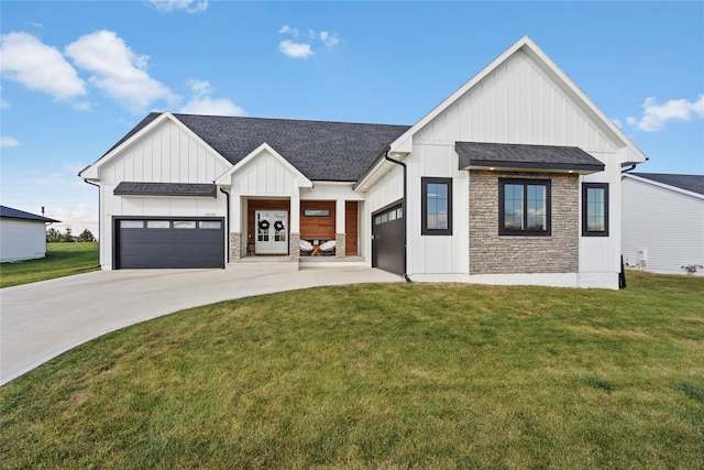 modern farmhouse featuring a garage and a front lawn