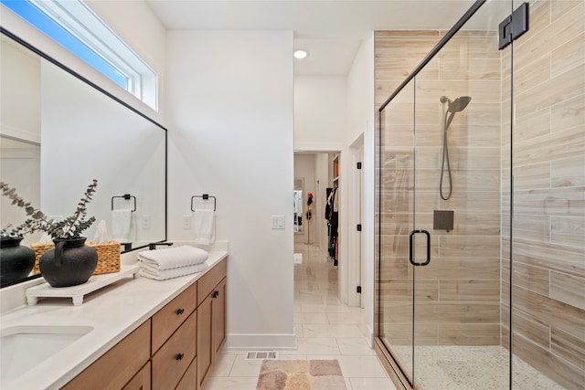 bathroom with vanity and walk in shower