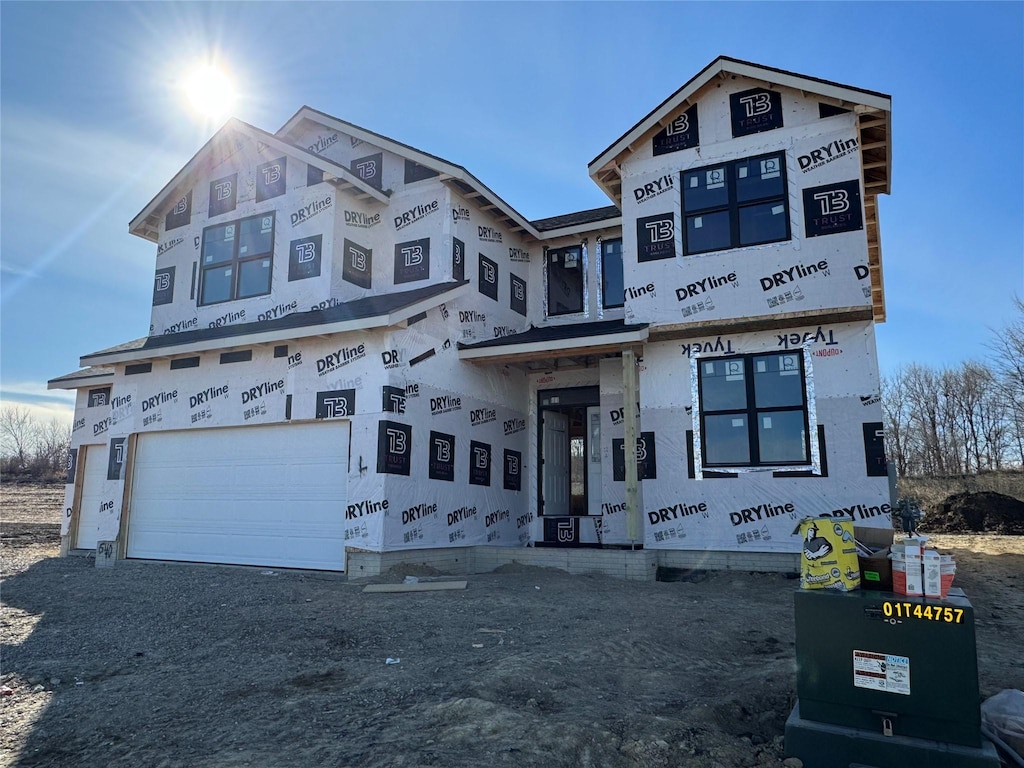 unfinished property featuring a garage