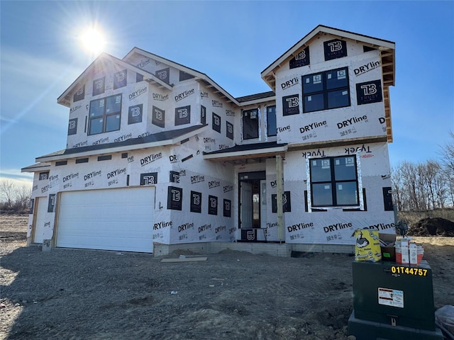 unfinished property featuring a garage