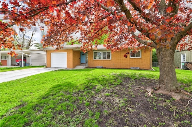 ranch-style home featuring a front lawn and a garage