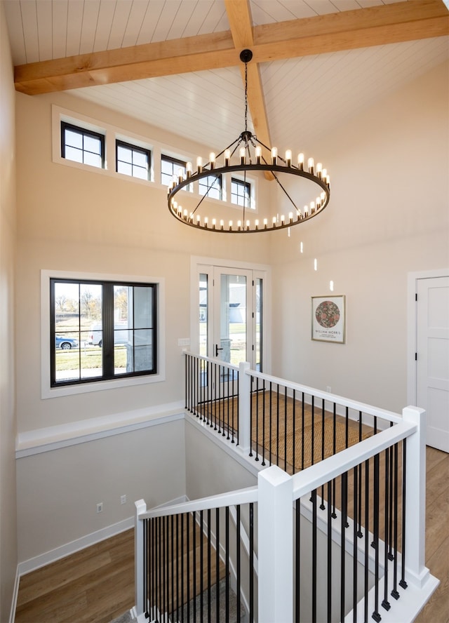 interior space featuring hardwood / wood-style floors, beam ceiling, and plenty of natural light