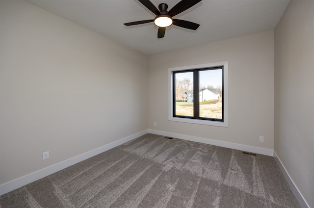 carpeted empty room with ceiling fan