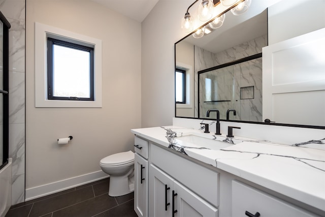 bathroom featuring vanity, a shower with shower door, toilet, and tile patterned floors