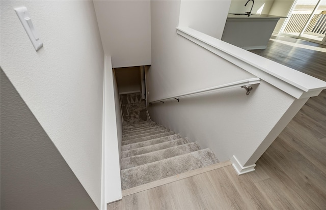 staircase featuring hardwood / wood-style floors