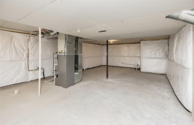 basement featuring heating unit