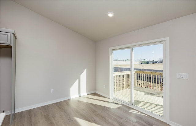 interior space with vaulted ceiling and light wood-type flooring