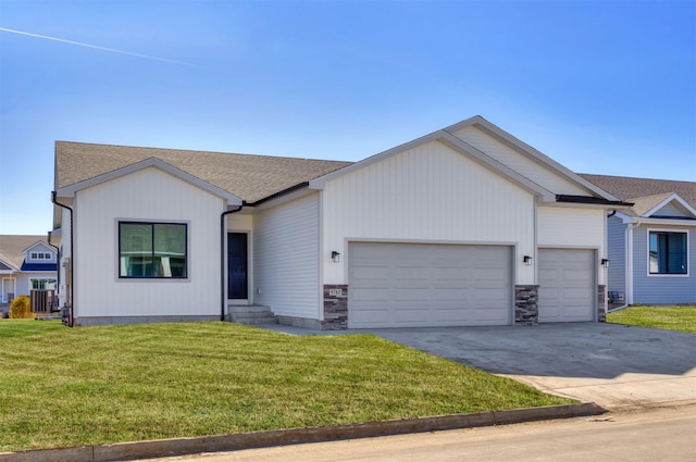 single story home featuring a garage, entry steps, concrete driveway, roof with shingles, and a front lawn