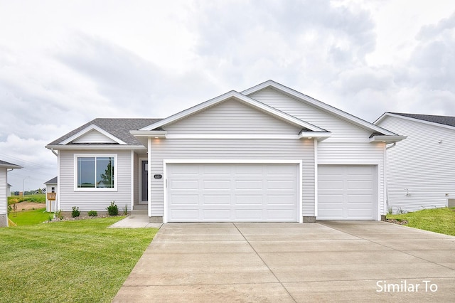 view of front facade featuring a garage and a front yard