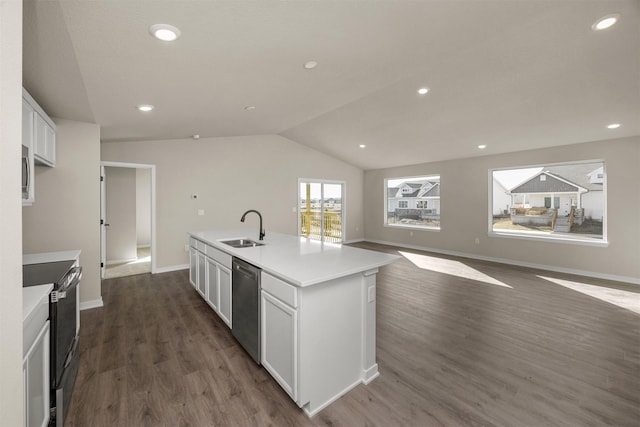 9748 Thorton Dr, Johnston, IA 50131 - kitchen with a sink, appliances with stainless steel finishes, dark wood finished floors, white cabinetry, and vaulted ceiling