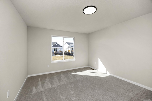 9748 Thorton Dr, Johnston, IA 50131 - carpeted spare room with baseboards