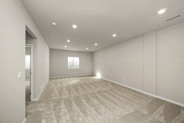 9748 Thorton Dr, Johnston, IA 50131 - spare room featuring light colored carpet, recessed lighting, baseboards, and a smoke detector