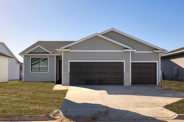 9748 Thorton Dr, Johnston, IA 50131 - view of front of house with an attached garage, concrete driveway, a front lawn, and brick siding