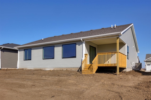 9748 Thorton Dr, Johnston, IA 50131 - back of house featuring cooling unit and a shingled roof