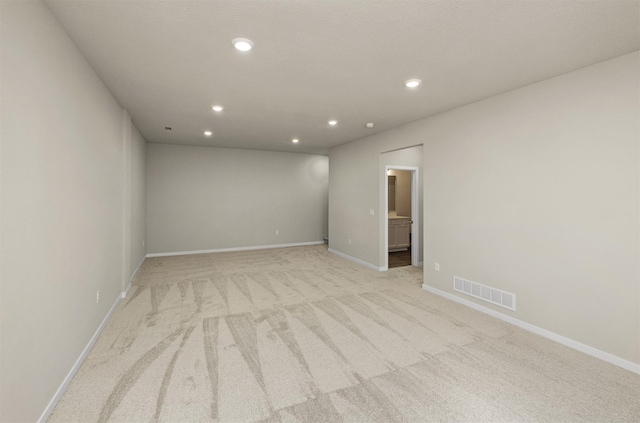 9748 Thorton Dr, Johnston, IA 50131 - unfurnished room with light colored carpet, recessed lighting, and baseboards