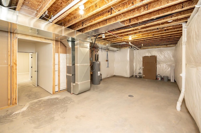 9748 Thorton Dr, Johnston, IA 50131 - unfinished below grade area featuring electric water heater and heating unit