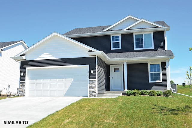 view of front of house with a front lawn and a garage